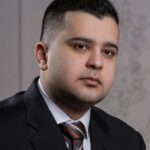 Business portrait of a young man in a suit with a necktie, shot in Tehran, Iran.